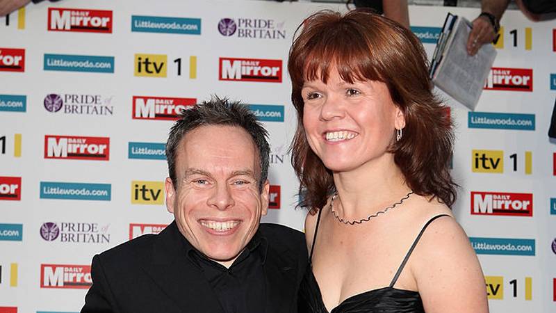 Actors Warwick Davis and his wife Samantha Davis on the red carpet.