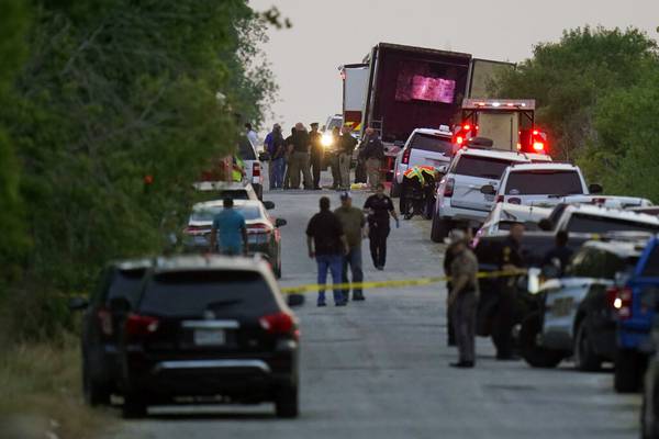 Death toll at 53 after migrants found crammed in abandoned tractor-trailer; 4 men charged