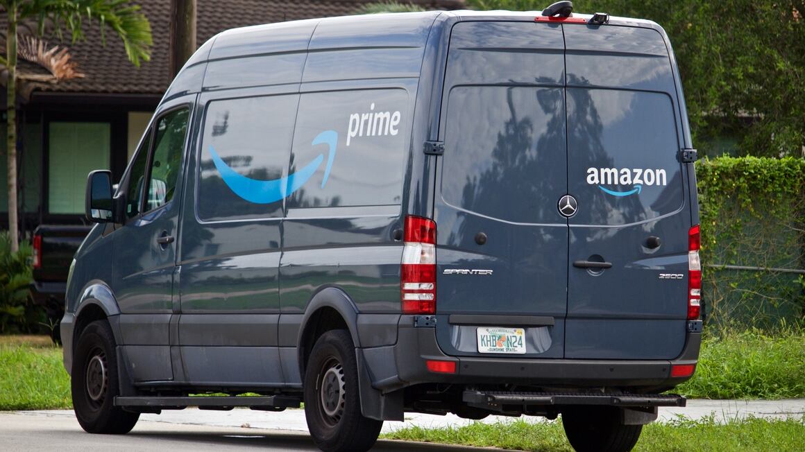 06-09-2019 Miami-Dade county Florida U.S.A. Amazon Prime delivery vehicle stops in residential neighborhood to deliver packages