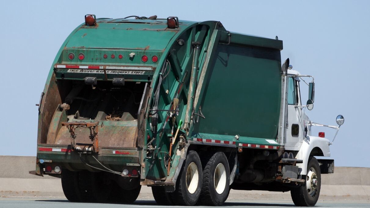 Woman rescued after falling into dumpster when throwing out trash, gets stuck in trash truck
